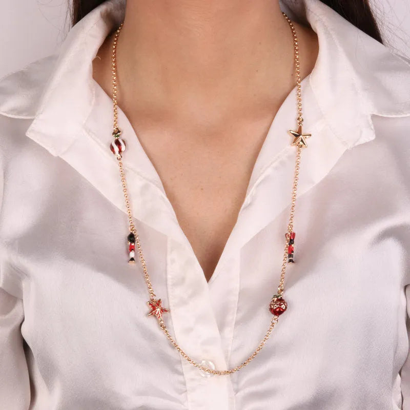 Metal necklace with pendants in the shape of a Christmas tree, balls, stars and nutcrackers