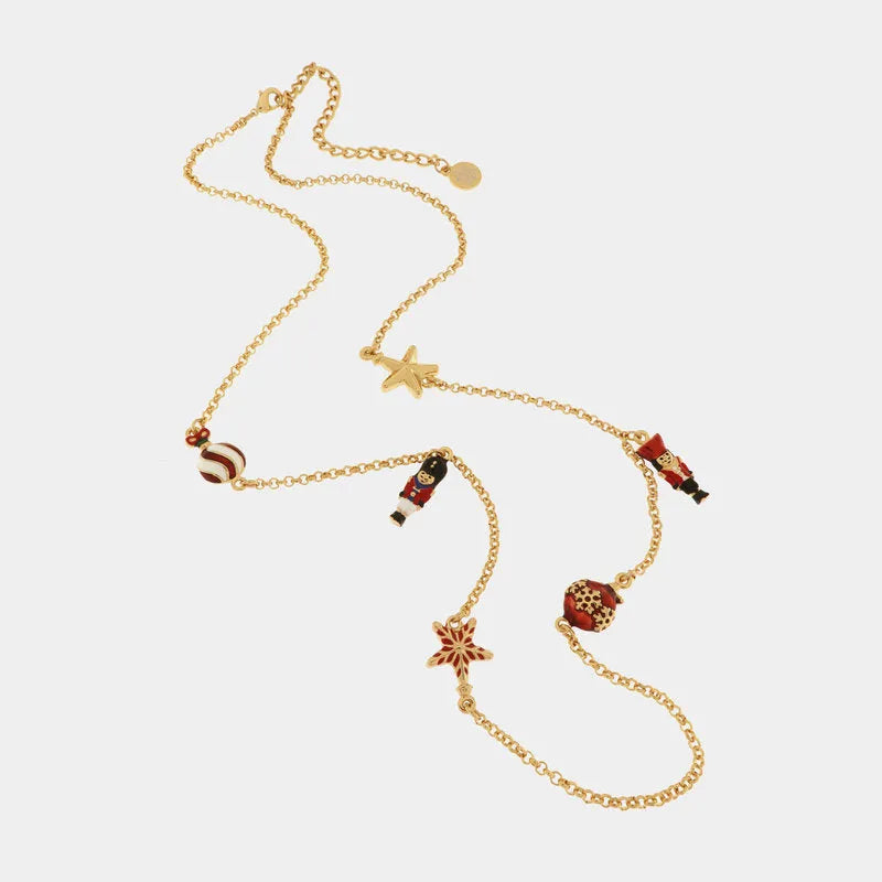 Metal necklace with pendants in the shape of a Christmas tree, balls, stars and nutcrackers