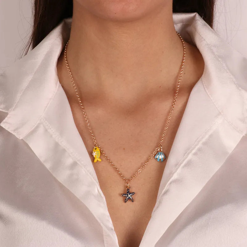Metal necklace with starfish and fish