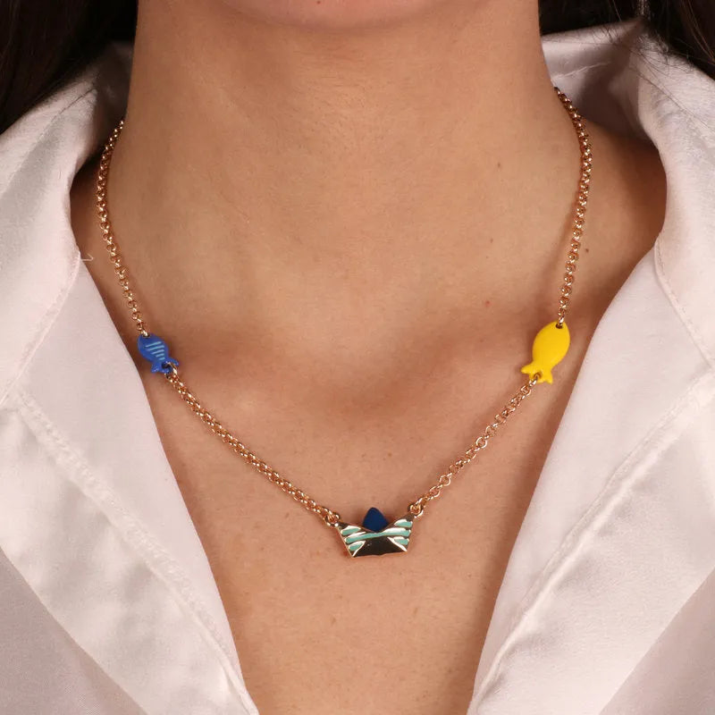 Metal necklace with boat and fish