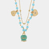 Collana in Metallo con campana smaltata turchese e cuoricini pendenti