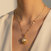 Collana in Metallo con pumo placcato oro