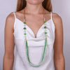 Long metal necklace with green pearls and multi-strand pendant