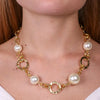 Metal necklace with pearls and intertwined circles