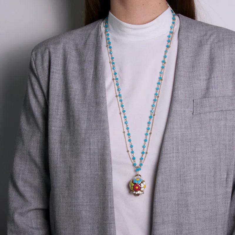 Multi-strand blue metal necklace with multicolor flower bell