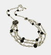 Collana in Metallo multifilo con perle e fiore nero