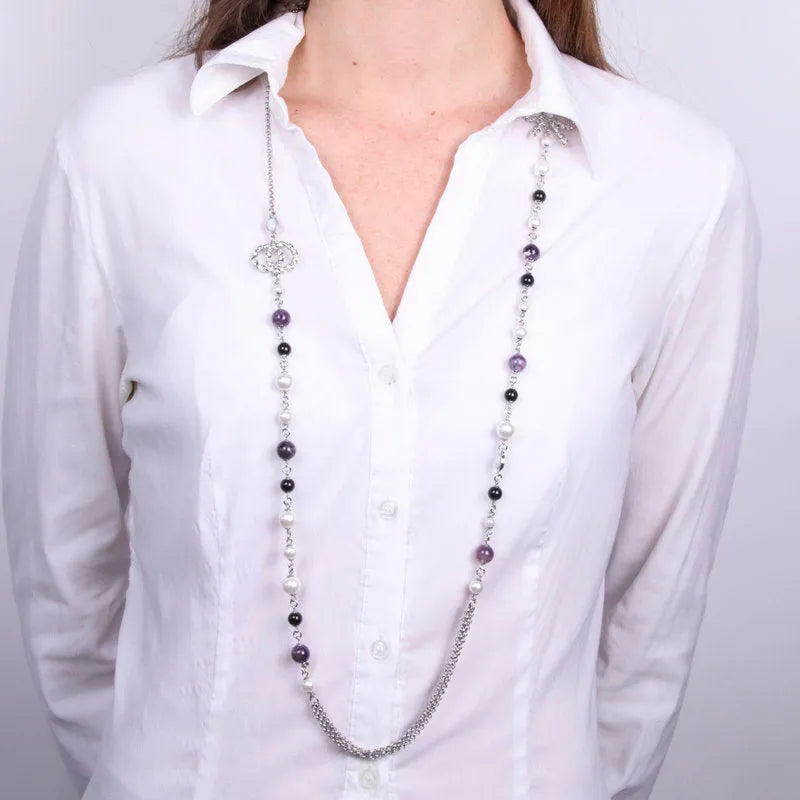 Metal necklace with black and white pearls and multiple strands