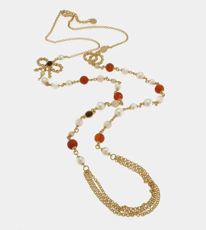 Multi-strand metal necklace with bow and pearls