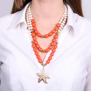 Collana in Metallo conchigla con sfere rosse e bianche