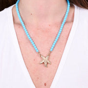 Collana in Metallo sfere turchesi con stella marina bianca