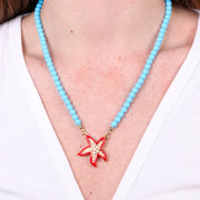 Collana in Metallo sfere turchesi con stella marina rossa