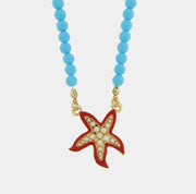 Collana in Metallo sfere turchesi con stella marina rossa