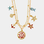Collana in Metallo con stelle marine, conchiglie, pesciolino, ancora e corallo