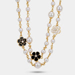 Collana in Metallo multifilo con sfere perlate e fiori smaltati bianchi e neri - BYSIMON gioielli