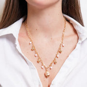 Collana in Metallo con sfere colorate e campanella con cerchi rosa e cristalli in rilievo