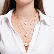 Collana in Metallo multifilo con campanelle bianche di grandezze diverse con cristalli luminosi