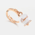 Anello in Metallo con campanella portafortuna pendente impreziosita da smalto bianco e cristalli