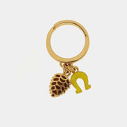 Anello in Metallo con pigna e ferro di cavallo in smalto giallo