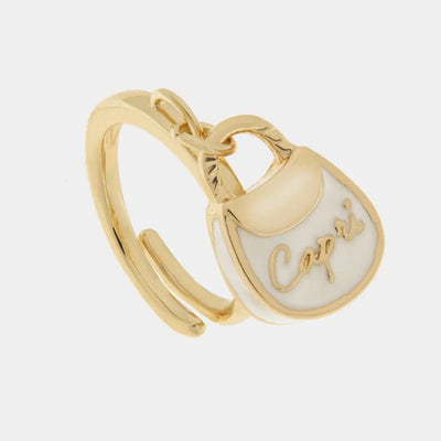 Metal ring with white bag written capri