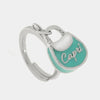 Anello in Metallo con borsa verde acqua scritta capri
