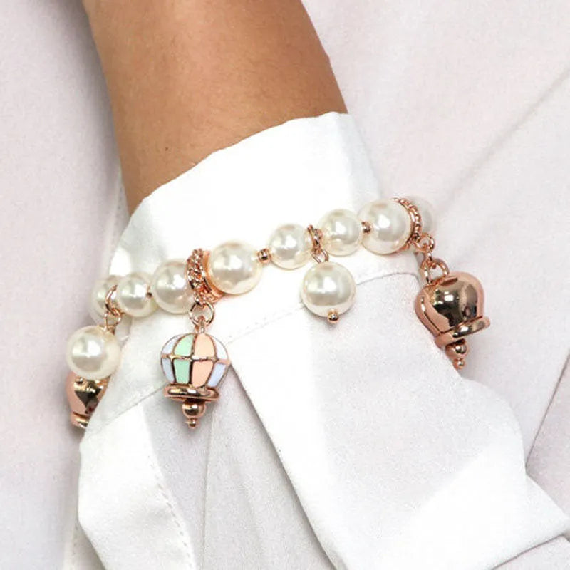 Bracciale in Metallo con perle e campane colorate - BYSIMON gioielli