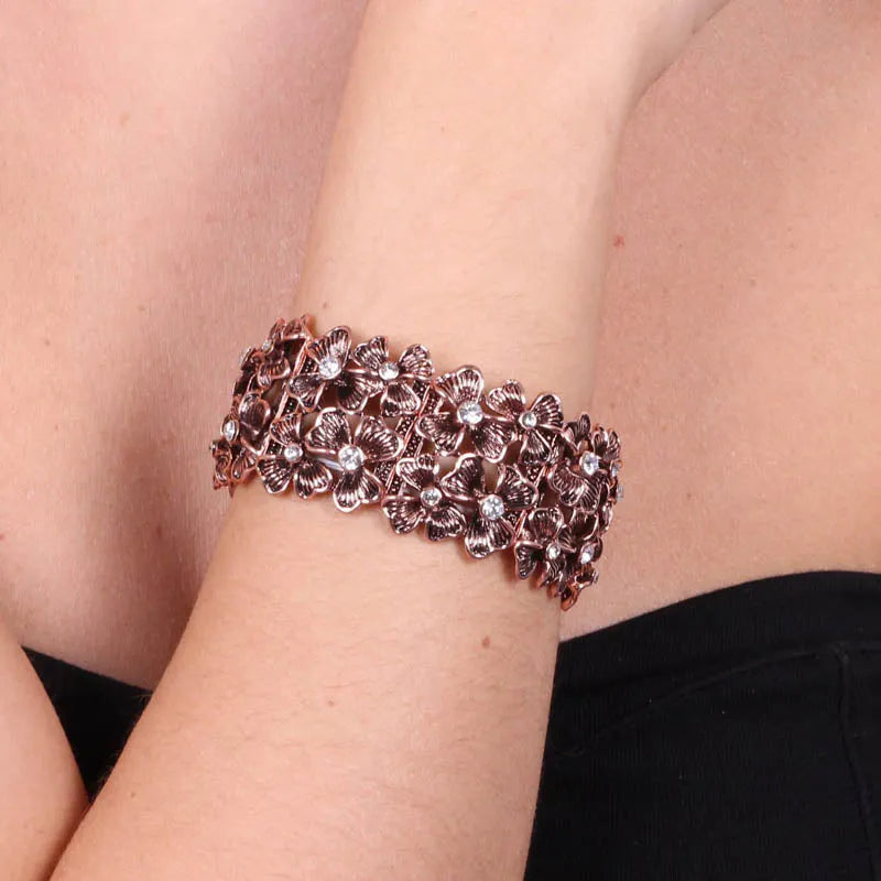 Bracciale in Metallo elastico, con fiori e cristalli