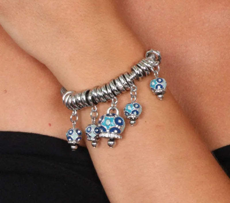 Bracciale in Metallo multiciondoli pendenti con campanelle azzurre e cristalli luminosi - BYSIMON gioielli