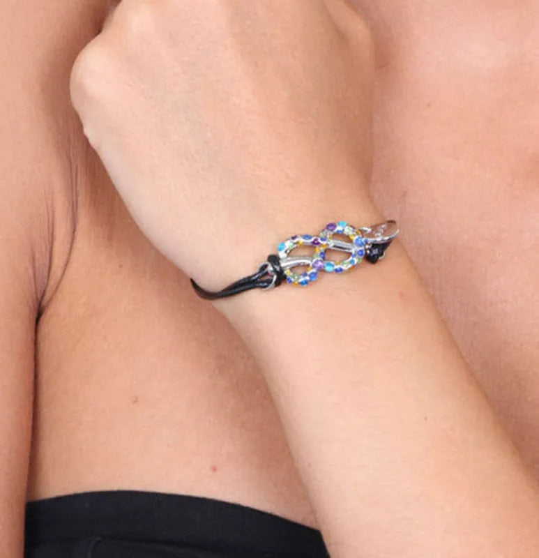 Bracciale in Metallo in caucciu, con simbolo infinito impreziosito da cristalli multicolore