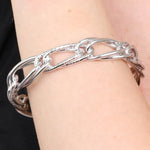Bracciale in Metallo rigido stile schiava con anelli ad intreccio