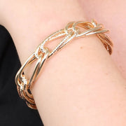 Bracciale in Metallo rigido stile schiava con anelli ad intreccio