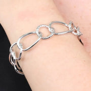 Bracciale in Metallo rigido stile schiava con anelli ad intreccio