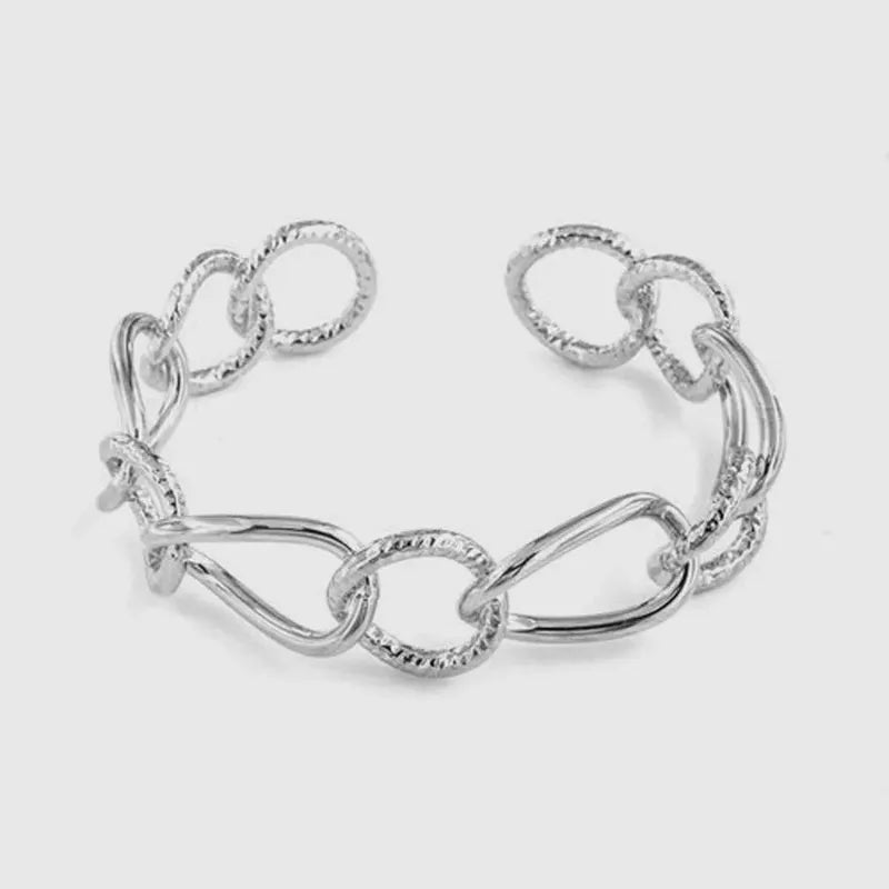 Bracciale in Metallo rigido stile schiava con anelli ad intreccio