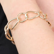 Bracciale in Metallo rigido stile schiava con anelli ad intreccio