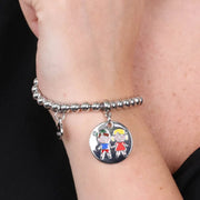 Bracciale in Metallo  con medaglia simbolo bimbi impreziosito da smalti colorati