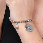 Bracciale in Metallo  con medaglia simbolo bimbo impreziosito da smalti colorati
