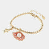Bracciale in Metallo con ciondolo conchiglia pendente, impreziosita da smalto rosa e perla