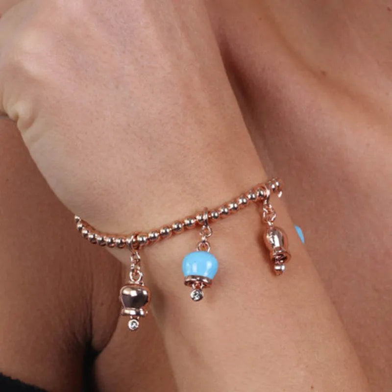 Bracciale in Metallo maglia sfere, con ciondoli campanelle portafortuna, impreziosite da smalto turchese e cristalli - BYSIMON gioielli