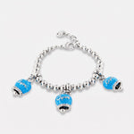 Bracciale in Metallo maglia a sfere, con tre campanelle portafortuna smaltate azzurre e cristalli
