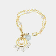 Bracciale in Metallo multifilo, con pendente a cerchi,  impreziosito da sfere effetto perla