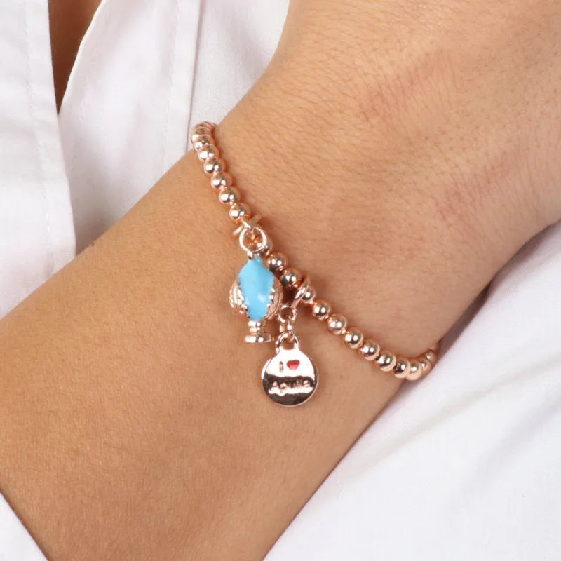 Bracciale pumo pugliese pendente azzurro rosè | pumo portafortuna pugliese | BYSIMON