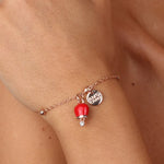 Bracciale in Metallo con campanella portafortuna pendente, impreziosita da smalto rosso e punto luce - BYSIMON gioielli