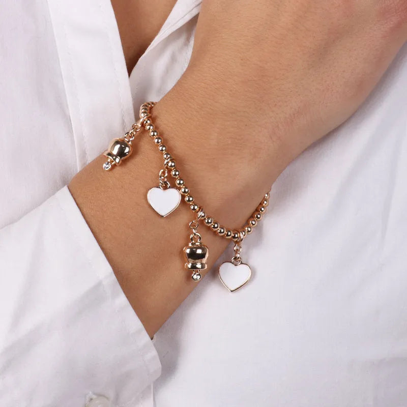 Bracciale in Metallo multi ciondoli a forma di campanella e cuori in smalto bianco - BYSIMON gioielli