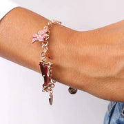 Bracciale in Metallo con dettaglio a forma di Campania e pendenti a forma di cuore con scritta Capri, delfino e fiore impreziositi da smalti colorati