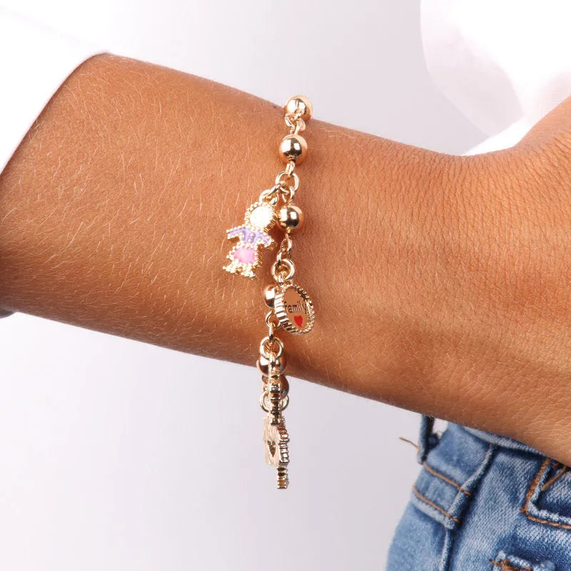 Bracciale in Metallo con pendenti a forma di mamma, fiore rosa, papà, bimbo e casa con cuore - BYSIMON gioielli