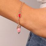 Bracciale in Metallo con cuore rosso e campanella portafortuna pendente, impreziosita da smalto rosa e punto luce - BYSIMON gioielli