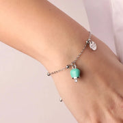 Bracciale in Metallo con campanella portafortuna pendente, impreziosita da smalto verde acqua e punto luce