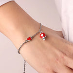 Bracciale in Metallo con cuore e campanella portafortuna rossa - BYSIMON gioielli