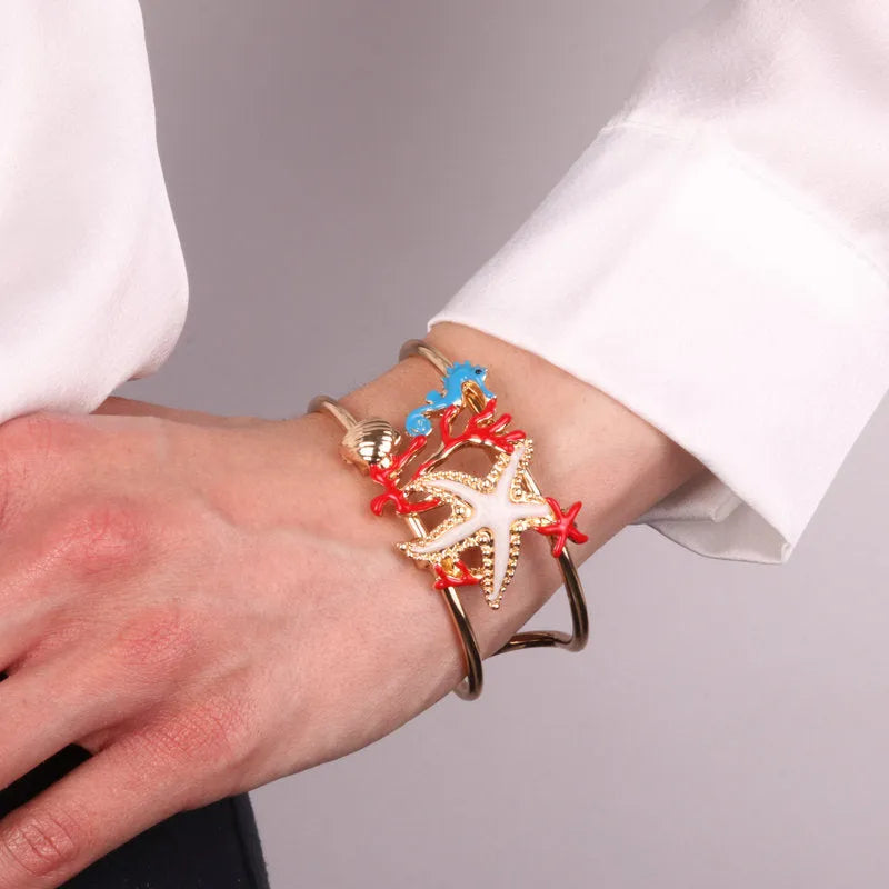 Bracciale in Metallo con stella marina, conchiglia, corallo e cavalluccio marino BYS - gioiello BySimon
