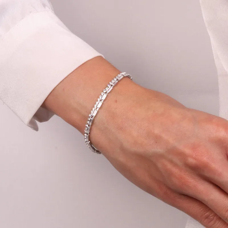 Metal bracelet with white crystals