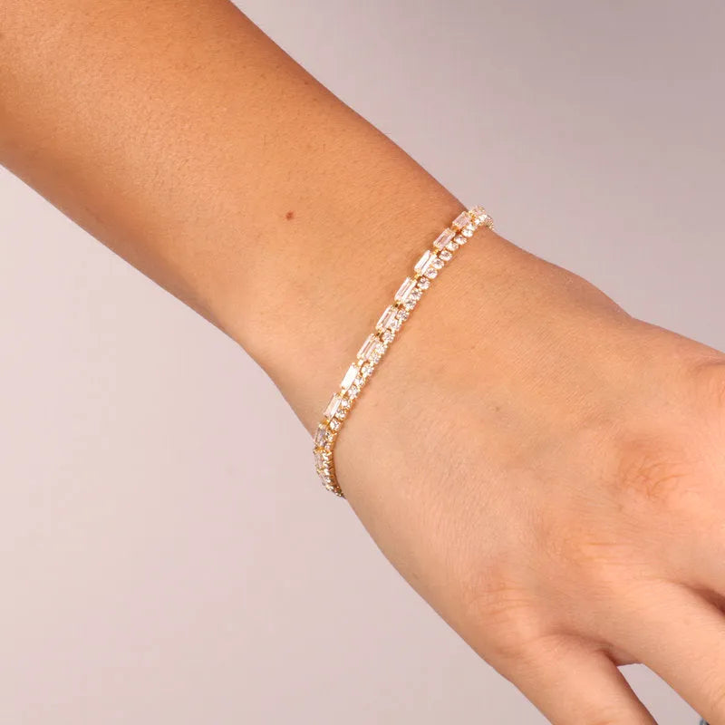 Metal bracelet with white crystals